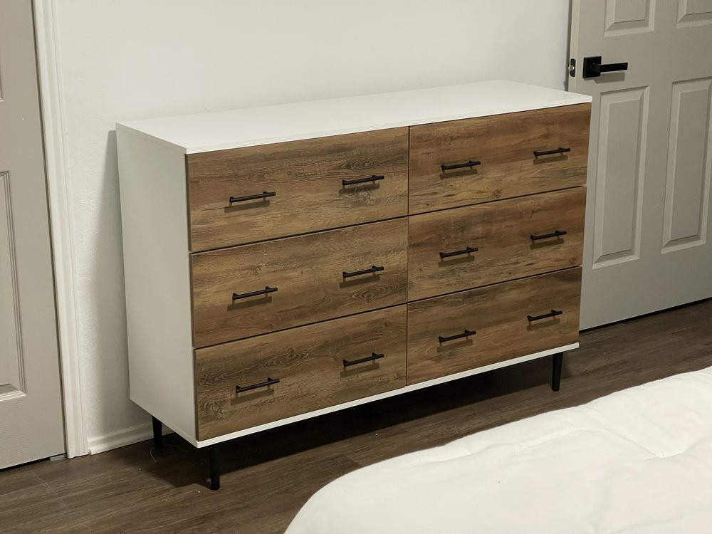 Two-tone six-drawer dresser assembled in an Austin bedroom
