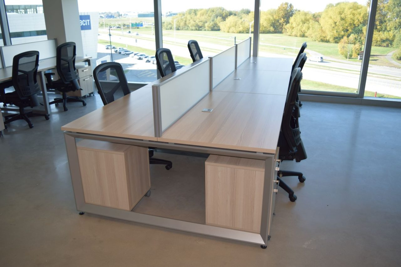 Row of assembled office workstations with dividers